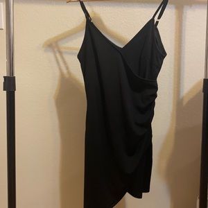 gorgeous little black dress with a flirty slit